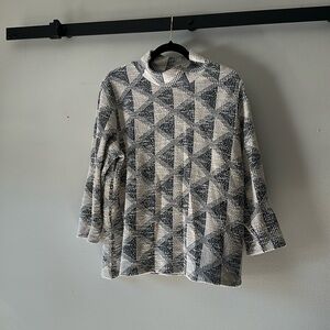 Mock neck 3/4 length sleeve top sold by Anthropologie